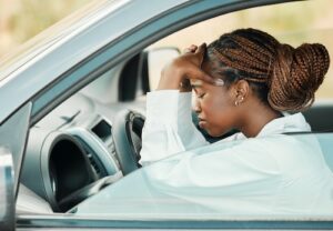 Woman With Headache in Car - Headache After Car Accident Didn't Hit Head
