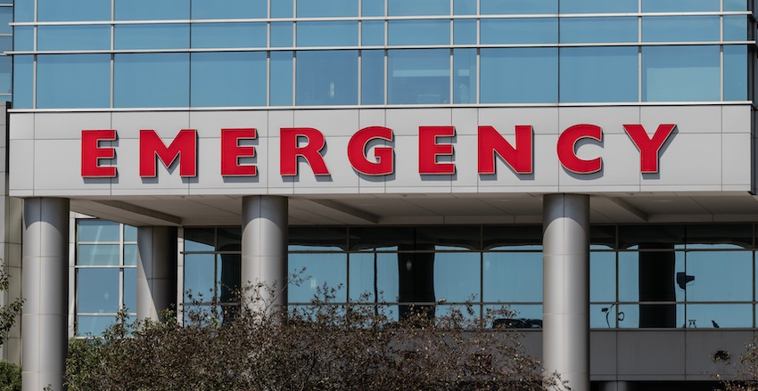 A hospital emergency room entrance with red signage where car accident victims will receive immediate medical treatment in Atlanta.