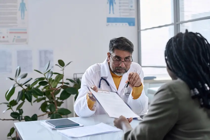 Insurance adjuster pressuring car accident victim to settle claim before reaching maximum medical improvement
