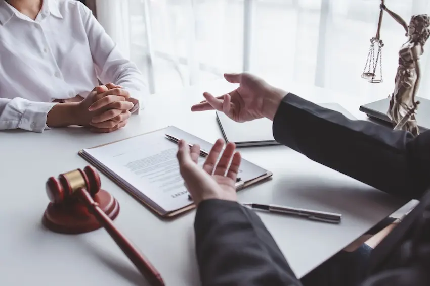 Atlanta car accident attorney reviewing MMI medical report to calculate full settlement value for injured client