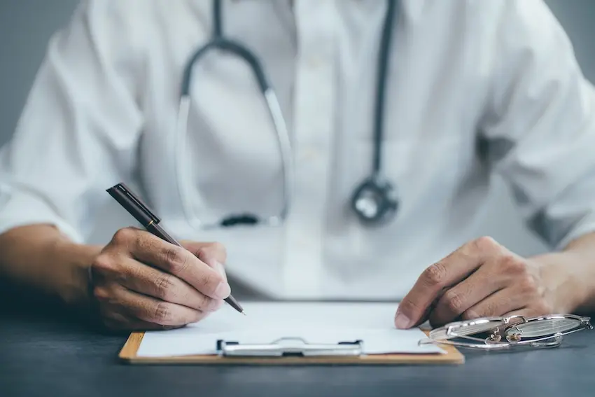 Insurance adjuster pressuring car accident victim to settle claim before reaching maximum medical improvement