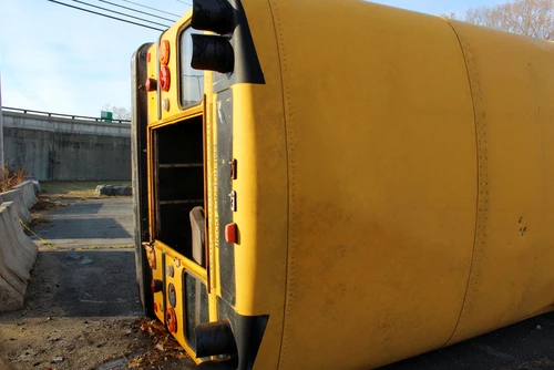 Tipped Over School Bus in a Case Handled by a Bus Accident Lawyer
