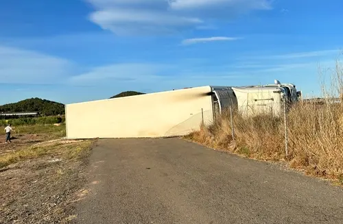 A 18-wheeler tilted over due to an accident to represent a case where a Kennesaw truck accident lawyer would be involved.